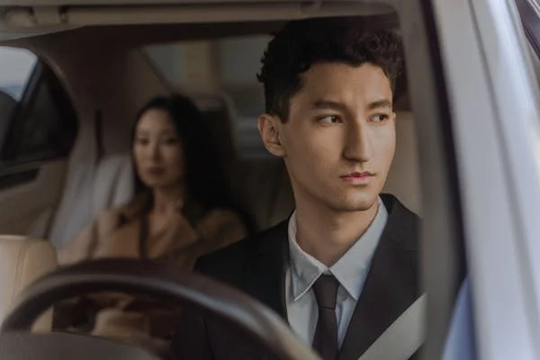 man and woman in car